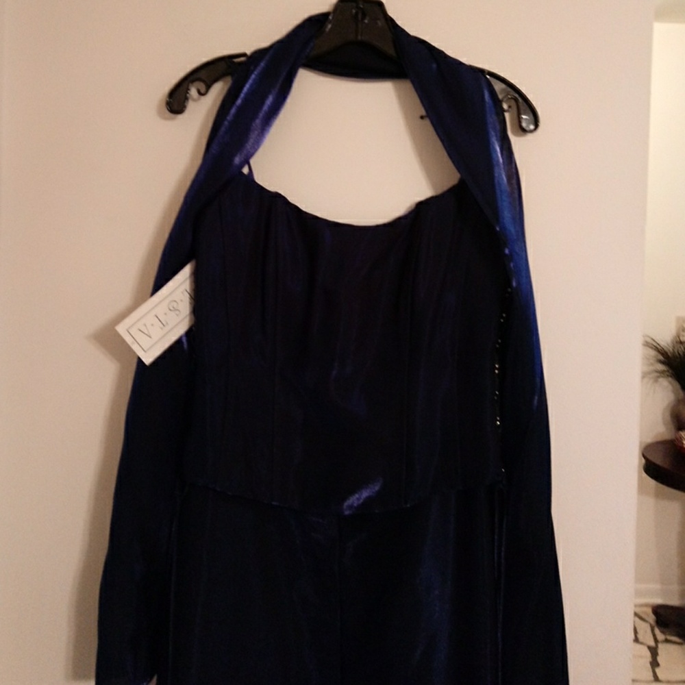 Skirt and top. Has scarf.. Damage on corset string